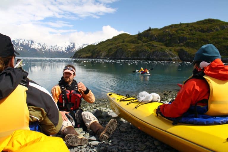 guide gives instructions to kayak guests in prince william sound